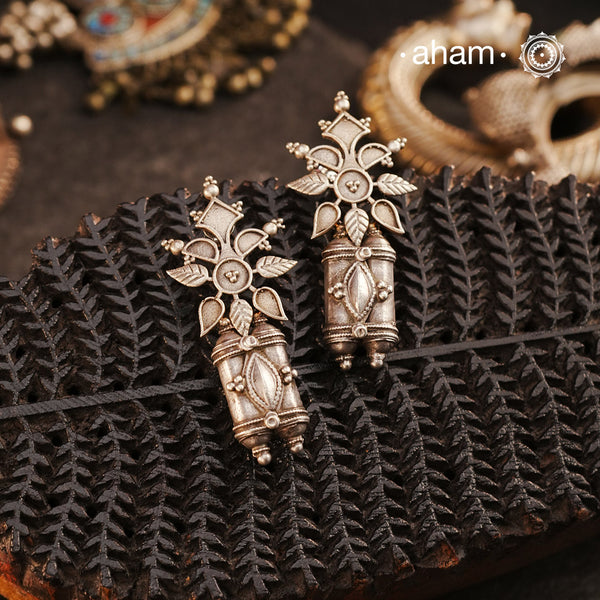 An exquisite fusion of old and new, these Tribal Amulet Silver Earrings showcase vintage tribal amulets paired with a delicately crafted floral motif. This unique combination reflects the artistry of traditional silversmithing while embracing contemporary design. Made in silver, these earrings are perfect for adding an ethnic yet versatile touch to your collection