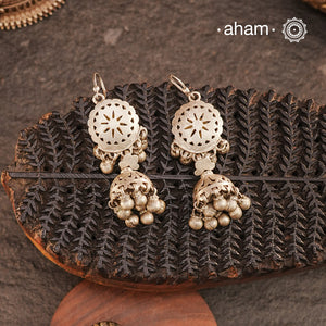 Rooted in the Rajasthan region, our Tribal Silver Jhumkies showcase intricate punch-cut work — a testament to ancient designs that continue to captivate. Traditionally worn as earplugs, we’ve reimagined them with a fishhook for effortless wear. Crafted in&nbsp;silver, these earrings offer a timeless touch of tribal elegance for any occasion.