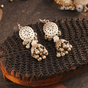 Rooted in the Rajasthan region, our Tribal Silver Jhumkies showcase intricate punch-cut work — a testament to ancient designs that continue to captivate. Traditionally worn as earplugs, we’ve reimagined them with a fishhook for effortless wear. Crafted in&nbsp;silver, these earrings offer a timeless touch of tribal elegance for any occasion.