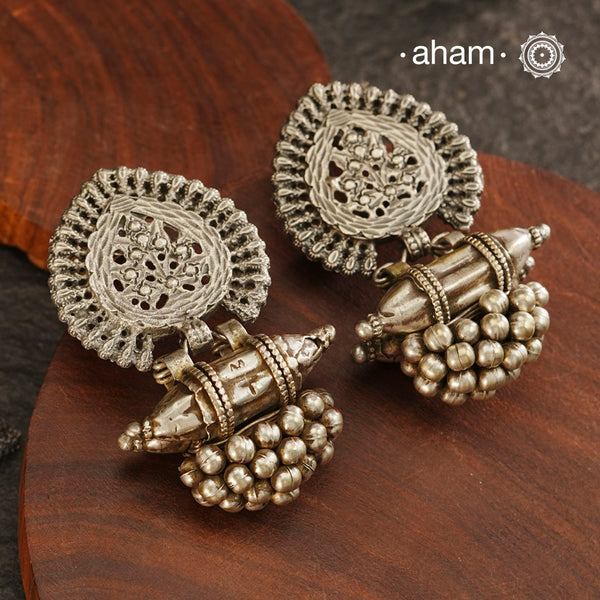 An exquisite fusion of the past and present, these Vintage Tribal Earrings unite two beautiful silver pieces. The top features an intricate leaf pattern stud while the bottom showcases a vintage amulet, steeped in history. Handcrafted in silver, this unique piece is a must-have for those who cherish tribal heritage jewellery with a story to tell.