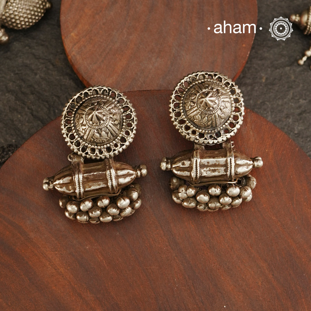 An exquisite fusion of the past and present, these Vintage Tribal Earrings unite two stunning silver pieces. The top features a newly made stud with old world feel, while the bottom showcases a vintage amulet, steeped in history. Handcrafted in silver, this unique piece is a must-have for those who cherish Tribal heritage jewellery with a story to tell.