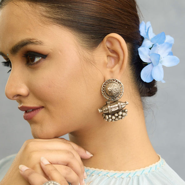 An exquisite fusion of the past and present, these Vintage Tribal Earrings unite two stunning silver pieces. The top features a newly made stud with old world feel, while the bottom showcases a vintage amulet, steeped in history. Handcrafted in silver, this unique piece is a must-have for those who cherish Tribal heritage jewellery with a story to tell.