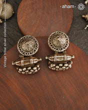 An exquisite fusion of the past and present, these&nbsp;Vintage Tribal Earrings&nbsp;unite two stunning silver pieces. The top features a newly made stud with old world feel, while the bottom showcases a vintage&nbsp;amulet, steeped in history. Handcrafted in&nbsp;silver, this unique piece is a must-have for those who cherish&nbsp;tribal heritage jewellery&nbsp;with a story to tell.