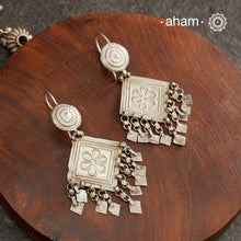 We bring to you traditional Pandadi Earrings crafted in silver.Read More about the Pandadi Earring below
Name: Pandadi, Panderi, Pandada, Jhuma PanderiOrigin:Saurashtra (Junagadh district) and Kutch
Community:Rabari and Harijan (Kutch), Mer and Ahir (Junagadh), Patel (Radhanpur), Jat (Kutch)
Mode of FasteningUsually comes withfish hook, Originally Worn in helix
MaterialMade in both Gold andSilver

The top is usually a flower shape which has a large 
