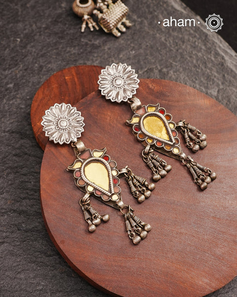 Old world pieces carry a distinct allure—timeless and exquisite, perfect as heirlooms. These tribal silver earrings featuring vibrant glass accents offer a stunning addition to your collection. The rich colors bring a striking contrast to any ensemble. Please note that as these earrings are handcrafted from assorted vintage components, slight variations between the pair are to be expected.