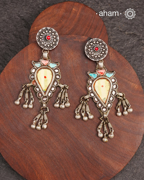 Old world pieces carry a distinct allure—timeless and exquisite, perfect as heirlooms. These tribal silver earrings featuring vibrant glass accents offer a stunning addition to your collection. The rich colors bring a striking contrast to any ensemble. Please note that as these earrings are handcrafted from assorted vintage components, slight variations between the pair are to be expected.
