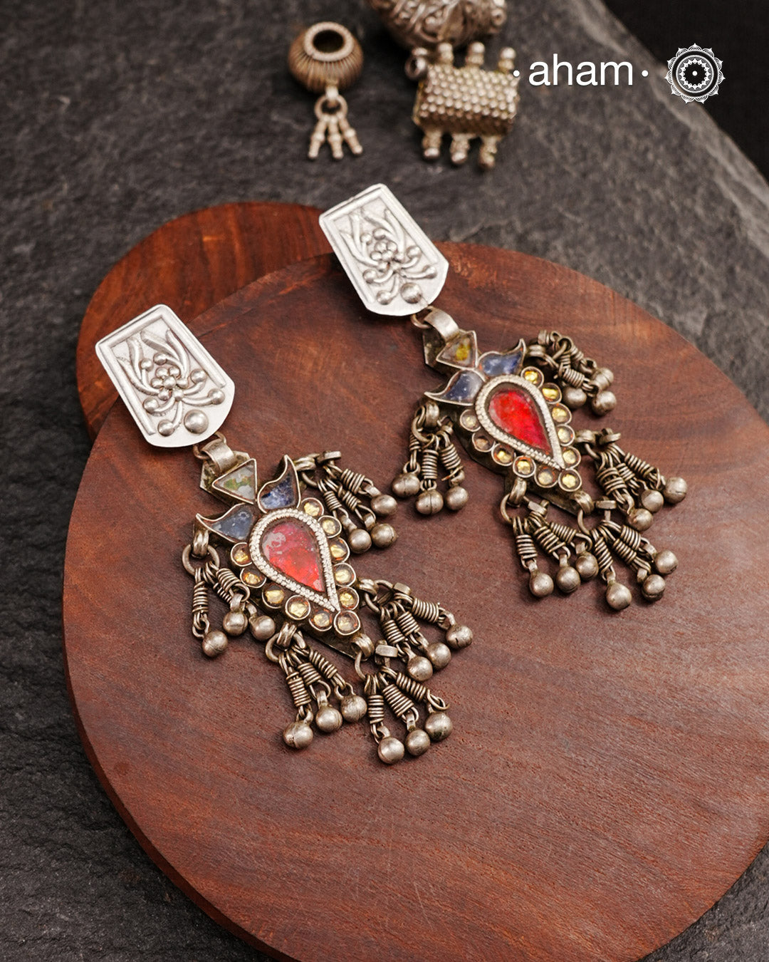 Old world pieces carry a distinct allure—timeless and exquisite, perfect as heirlooms. These tribal silver earrings featuring vibrant glass accents offer a stunning addition to your collection. The rich colors bring a striking contrast to any ensemble. Please note that as these earrings are handcrafted from assorted vintage components, slight variations between the pair are to be expected.