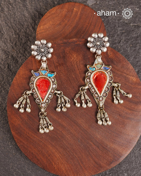 Old world pieces carry a distinct allure—timeless and exquisite, perfect as heirlooms. These tribal silver earrings featuring vibrant glass accents offer a stunning addition to your collection. The rich colors bring a striking contrast to any ensemble. Please note that as these earrings are handcrafted from assorted vintage components, slight variations between the pair are to be expected.