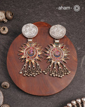 Old world pieces carry a distinct allure—timeless and exquisite, perfect as heirlooms. These tribal silver earrings featuring vibrant glass accents offer a stunning addition to your collection. The rich colors bring a striking contrast to any ensemble. Please note that as these earrings are handcrafted from assorted vintage components, slight variations between the pair are to be expected.