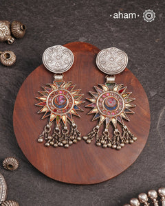 Old world pieces carry a distinct allure—timeless and exquisite, perfect as heirlooms. These tribal silver earrings featuring vibrant glass accents offer a stunning addition to your collection. The rich colors bring a striking contrast to any ensemble. Please note that as these earrings are handcrafted from assorted vintage components, slight variations between the pair are to be expected.