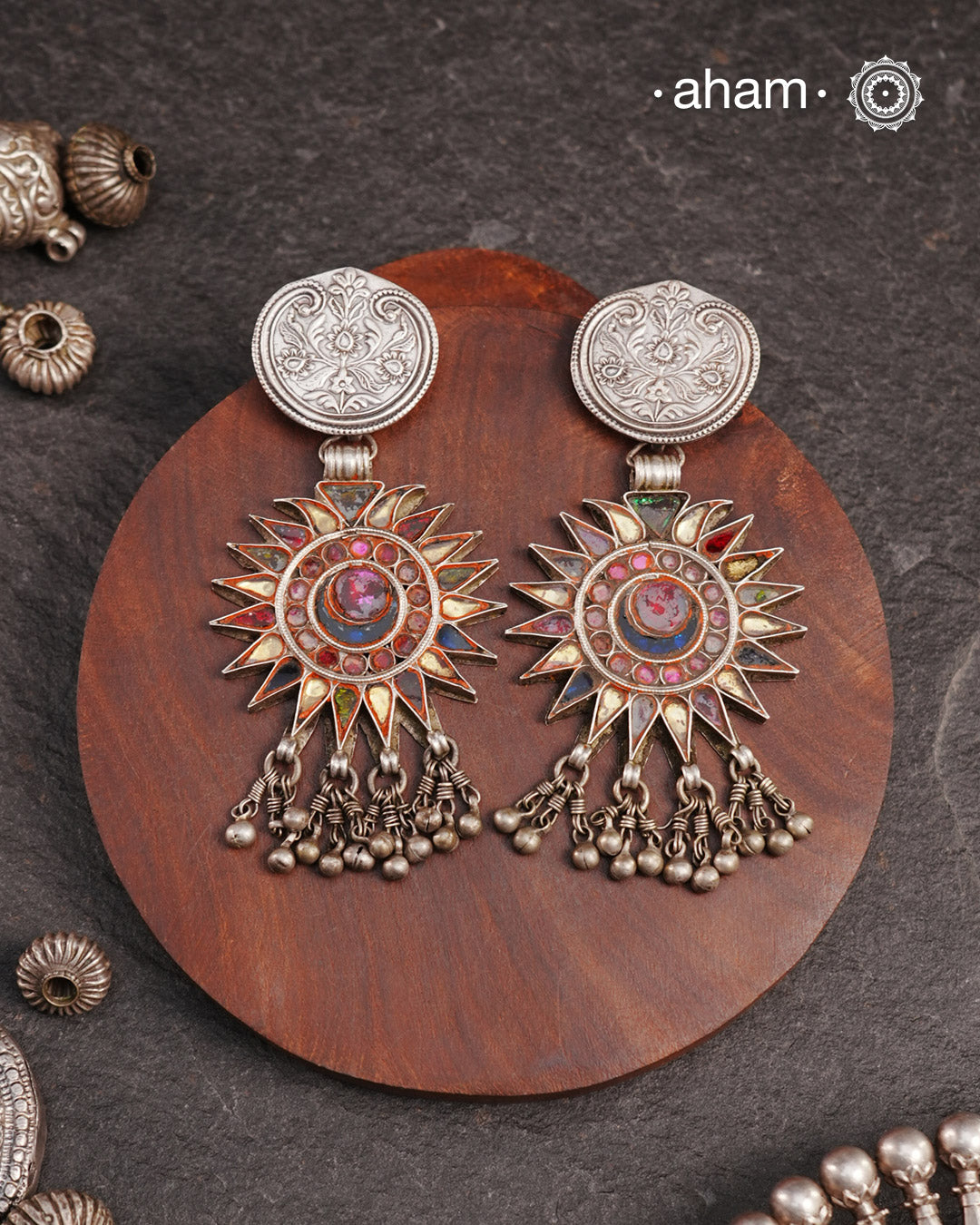 Old world pieces carry a distinct allure—timeless and exquisite, perfect as heirlooms. These tribal silver earrings featuring vibrant glass accents offer a stunning addition to your collection. The rich colors bring a striking contrast to any ensemble. Please note that as these earrings are handcrafted from assorted vintage components, slight variations between the pair are to be expected.