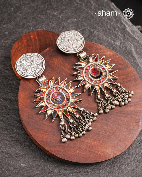 Old world pieces carry a distinct allure—timeless and exquisite, perfect as heirlooms. These tribal silver earrings featuring vibrant glass accents offer a stunning addition to your collection. The rich colors bring a striking contrast to any ensemble. Please note that as these earrings are handcrafted from assorted vintage components, slight variations between the pair are to be expected.