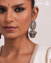 An exquisite fusion of the past and present, these Vintage Tribal Earrings unite two beautiful silver pieces.&nbsp; The top features an intricate leaf pattern stud&nbsp;while the bottom showcases a vintage amulet, steeped in history. Handcrafted in&nbsp;silver, this unique piece is a must-have for those who cherish tribal heritage jewellery with a story to tell.