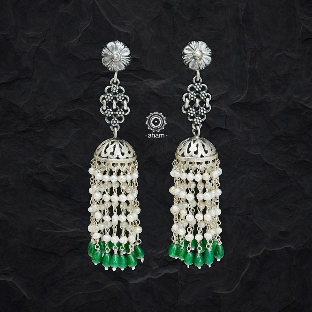 Enjoy the summer vibes with our Summer Love silver Jhumkies! Crafted with 92.5 silver and detailed with a stunning Green stones, these jhumkies make a perfect addition to any look. Shine all season with these classic but stylish earrings.