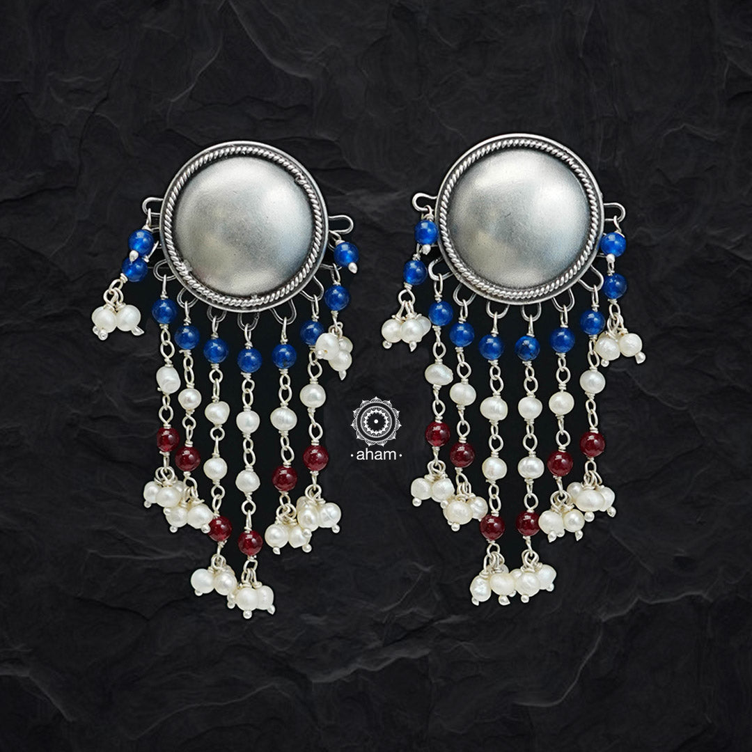 Handcrafted in 92.5 sterling silver with elegant flower motif stud and dangling semi precious beads. These festive jhumkie earrings are a showstopper. 