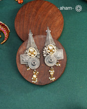 Handcrafted pieces of art put together to create this noori two tone earrings in 92.5 sterling silver with gold polish work, kundan work and cultured pearls.&nbsp;Style this up with your favourite ethnic or fusion outfit