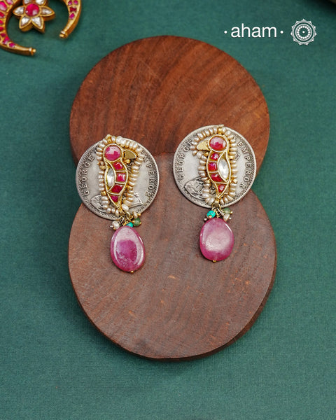 Handcrafted Noori two tone coin earrings in silver with pink semi precious stone. With beautiful bird motif and embellished cultured pearls.&nbsp;Style this up with your favourite ethnic or fusion outfit.