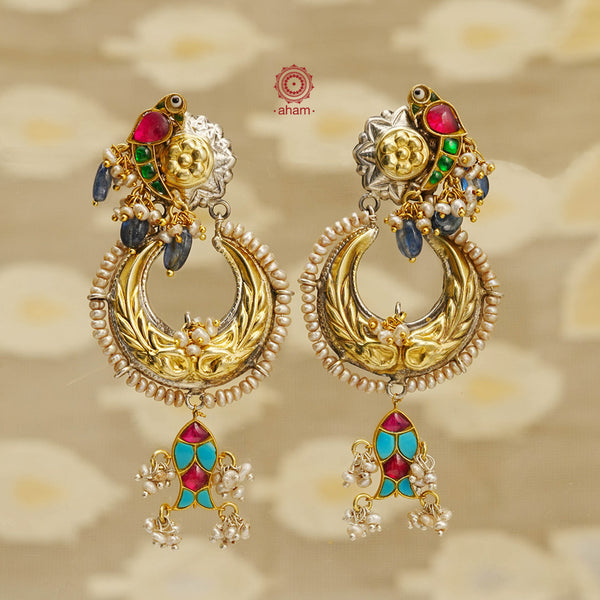 Handcrafted Noori two tone Chandbali earrings in 92.5 sterling silver. With beautiful parrot motif and embellished cultured pearls. Style this up with your favourite ethnic or fusion outfit. 