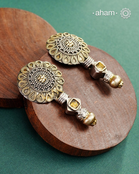 Handcrafted Noori two tone earrings in 92.5 sterling silver with beautiful floral  work. Style this up with your favourite ethnic or fusion outfit.