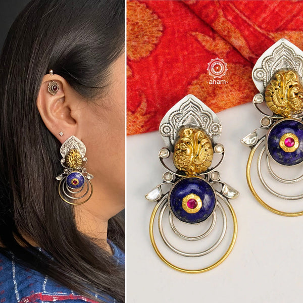 Dual Tone Earrings crafted in 92.5 sterling silver with Nakshi work Peacock, Lapiz stone highlight and kundan highlights. These earrings are a perfect accent to compliment a minimal ensemble. 