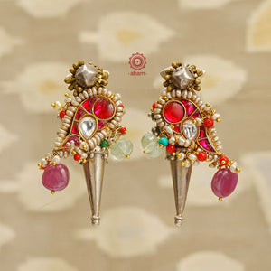 Handcrafted noori two tone earrings in 92.5 sterling silver. Beautiful parrot motif with kundan work, semi precious stones and cultured pearls. Style this up with your favourite ethnic or fusion outfit.