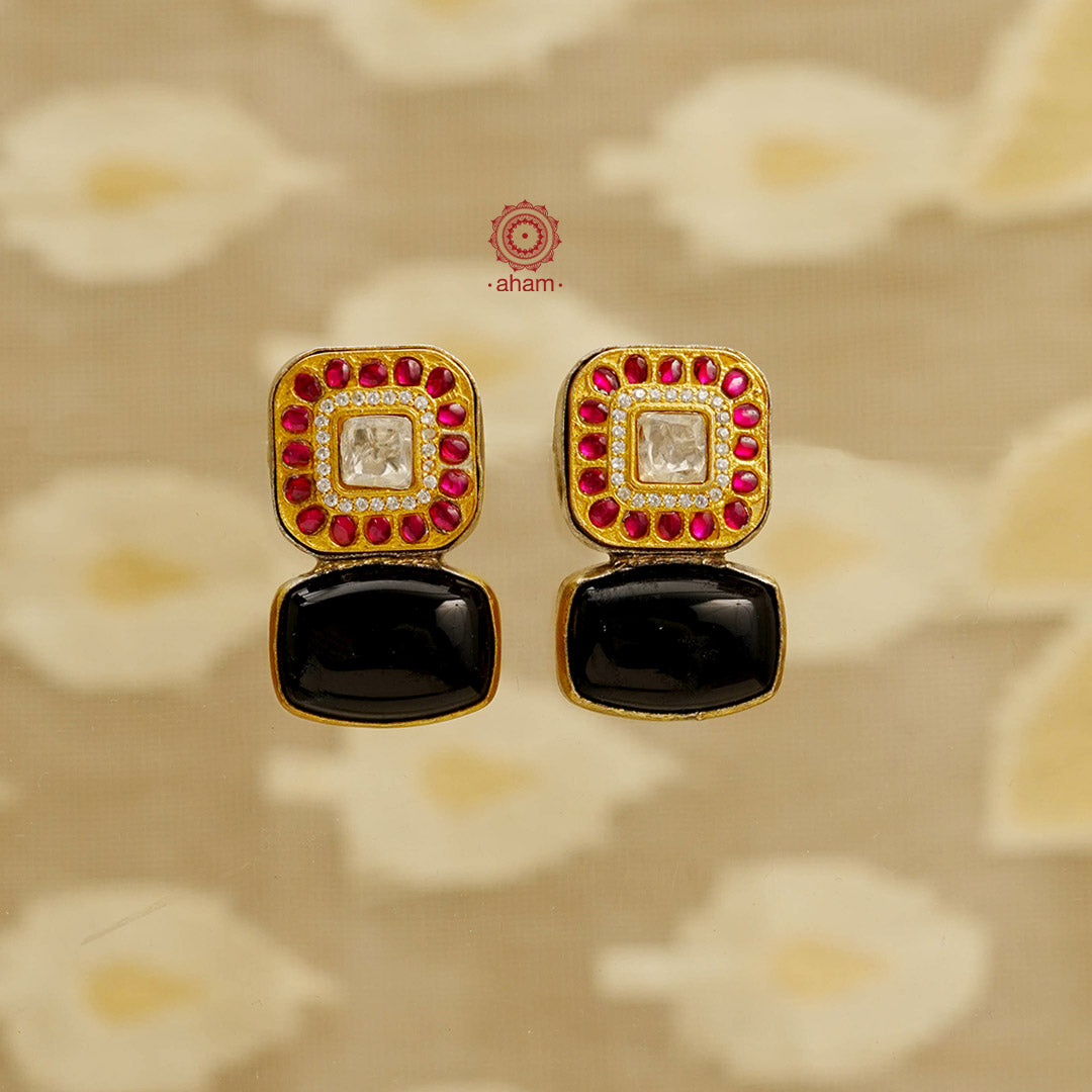 Noori two tone silver black onyx earrings. Handcrafted in 92.5 sterling silver with kundan work. Style this elegant earrings with your favourite ethnic or fusion outfits to complete the look.
