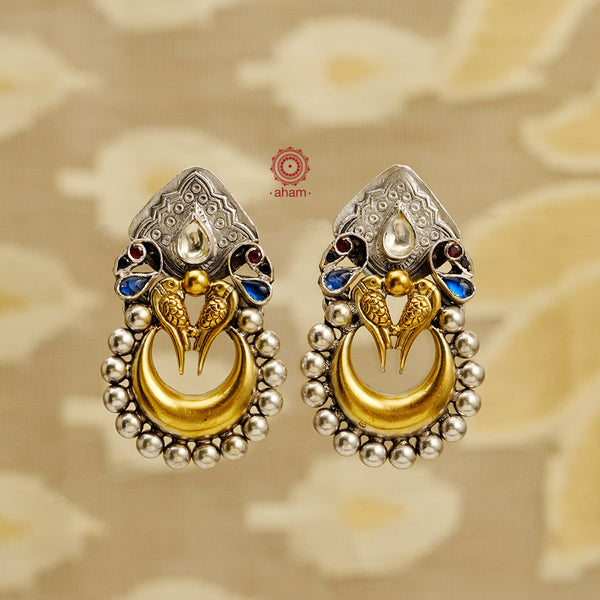 Noori two tone Parrot silver chandbali earrings with handcrafted in 92.5 silver with gold tones. Style this up with your favourite ethnic or fusion outfit.