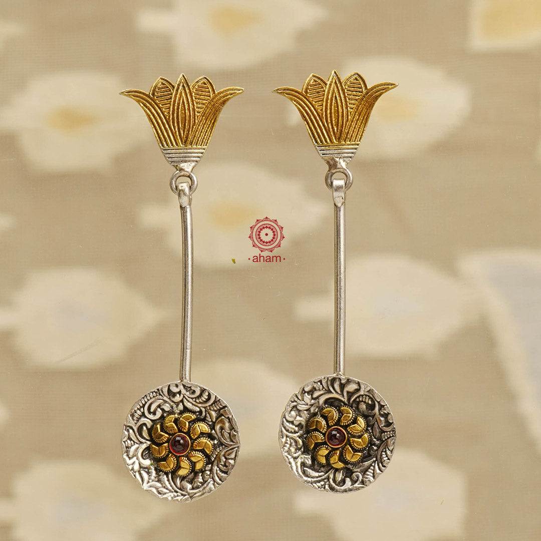 Crafted to perfection, these Noori Two Tone Silver Earrings feature a lotus design and dual tones that add a touch of elegance to any outfit. The lightweight earrings are easy to wear, making them the perfect addition to your jewellery collection.