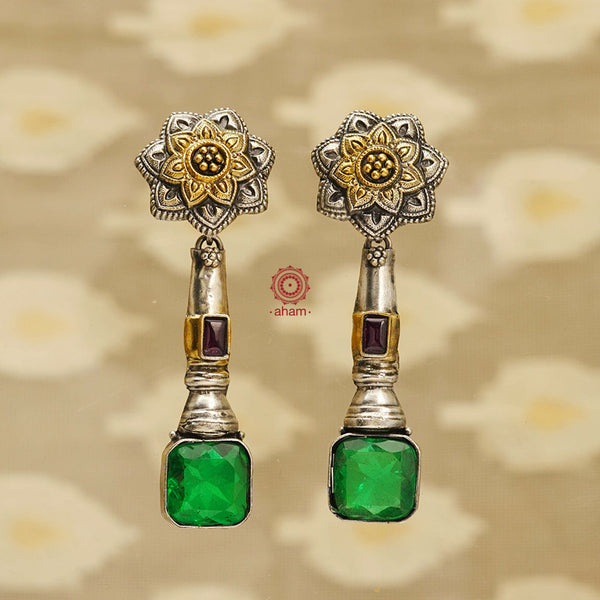 Noori two tone earrings in 92.5 sterling silver. Handcrafted earrings with beautiful faceted green stone and flower motifs. Style this up with your favourite ethnic or fusion outfit.