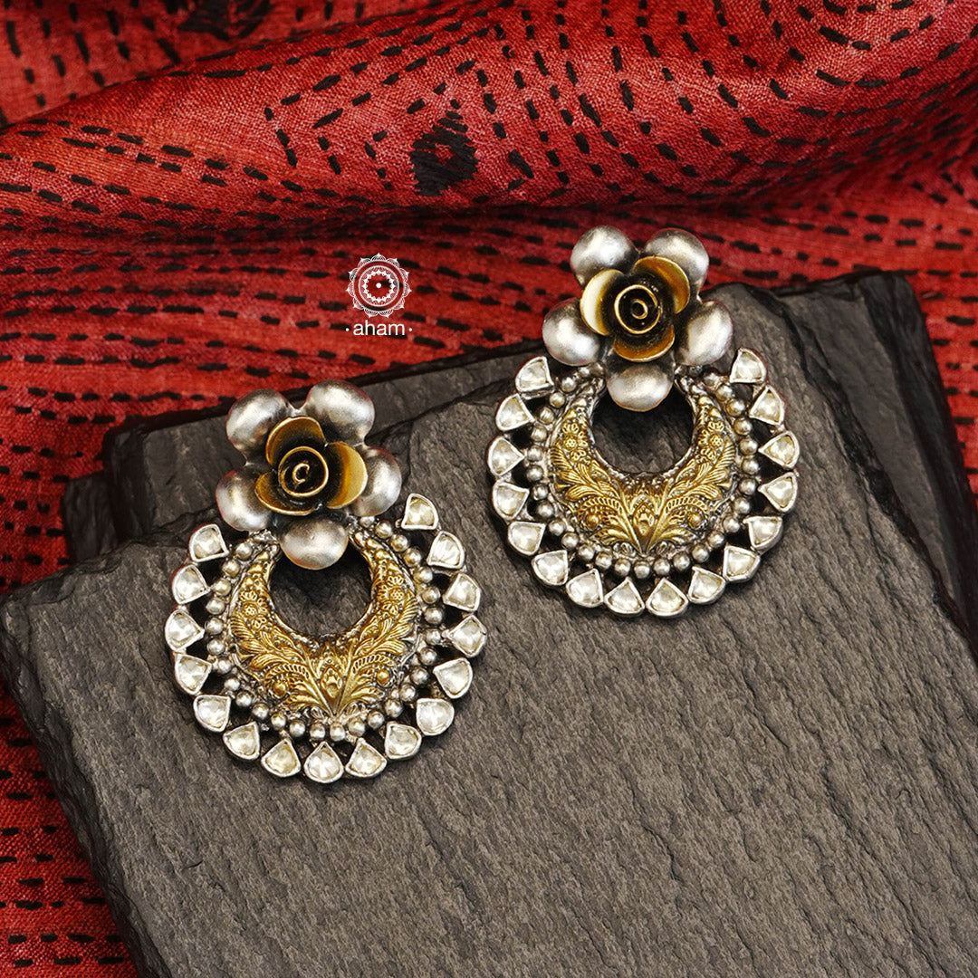 Noori two tone earrings with a blooming flower and kundan highlights, handcrafted in 92.5 sterling silver. Style this up with your favourite ethnic or western outfits to complete the look.