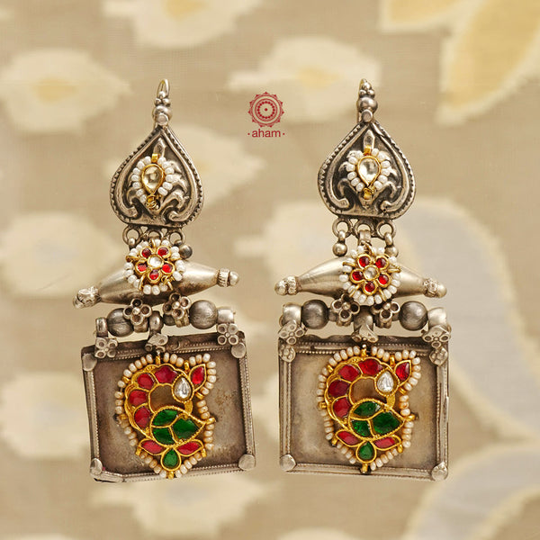 Noori two tone earrings with flower motif, handcrafted in silver.  Style this up with your favourite ethnic or fusion outfits to complete the look.