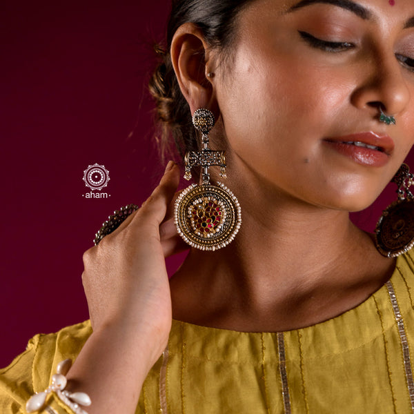 Noori two tone earrings with flower motif, handcrafted in 92.5 sterling silver. Style this up with your favourite ethnic or fusion outfits to complete the look.