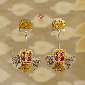 Add a touch of modern elegance to your ensemble with our Noori Two Tone Silver Earrings! Inspired by lotus flowers and crafted with silver and hints of gold, these lightweight earrings feature stunning kundan work at the center. Elevate your look with these unique and stylish earrings.