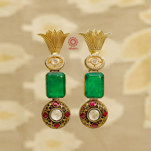 Noori two tone earrings with flower motif, faceted green stone and kundan work are handcrafted in 92.5 sterling silver. Style this up with your favourite ethnic or fusion outfits to complete the look.