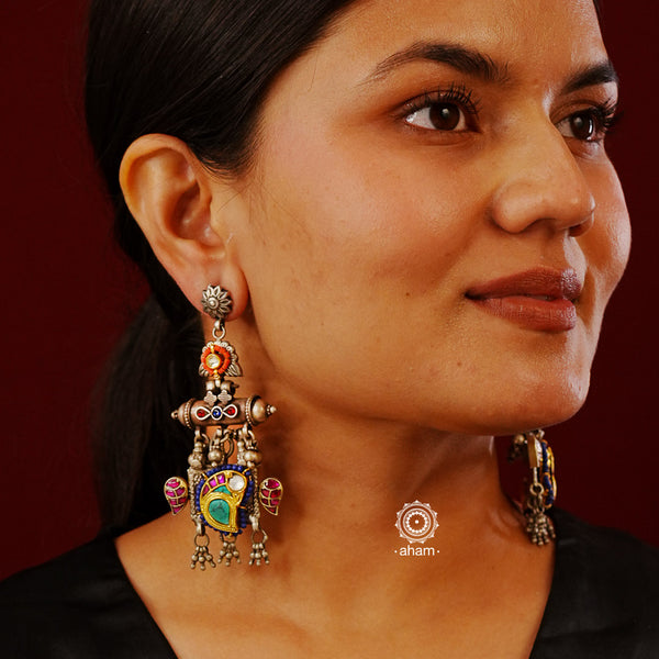 Noori statement silver two tone earrings. One of a kind piece, handcrafted with beautiful bird motif and semi precious stones. Style this up with your favourite ethnic or fusion outfit.