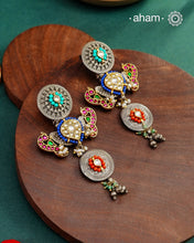 Noori statement silver two tone earrings with shades of silver and gold. One of a kind piece, handcrafted with beautiful&nbsp;bird motif and semi precious stones.&nbsp;Style this up with your favourite ethnic or fusion outfit.
