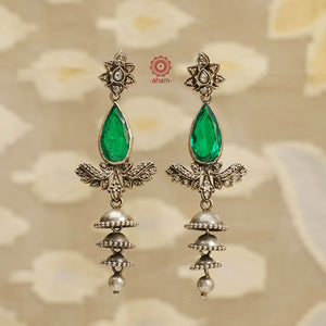 Expertly crafted for the festive season, our Festive Silver Jhumkies are an elegant addition to any outfit. These chandelier earrings feature multiple jhumkies and bright green faceted stone adding a touch of glamour to your look. Perfect for any occasion, these jhumkies are the perfect blend of tradition and style. 