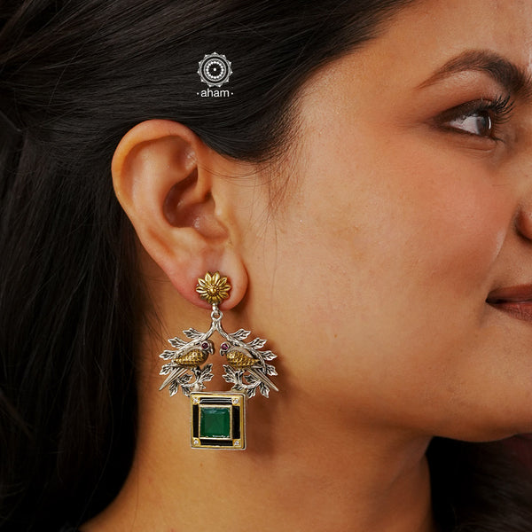 Noori two tone earrings in 92.5 sterling silver with two perfect little birds and a green stone highlight. Style this up with your favourite ethnic or fusion outfit.