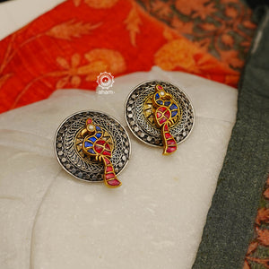 Noori two tone earrings in 92.5 sterling silver. Handcrafted earrings with beautiful peacock motif in the center.  Style this up with your favourite ethnic or fusion outfit.