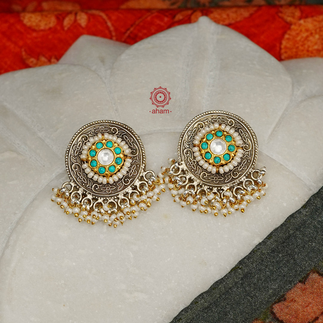Noori two tone earrings with little pearl. The earrings are handcrafted in 92.5 sterling silver with gold highlights. Style this up with your favourite ethnic or fusion outfits to complete the look.