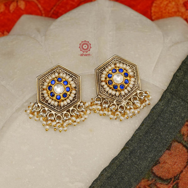 Noori two tone earrings with little pearl. The earrings are handcrafted in 92.5 sterling silver with gold highlights. Style this up with your favourite ethnic or fusion outfits to complete the look.