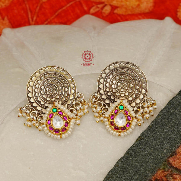 Noori two tone earrings with little pearls. The earrings are handcrafted in 92.5 sterling silver with gold highlights. Style this up with your favourite ethnic or fusion outfits to complete the look.