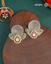 Noori two tone earrings with little pearls. The earrings are handcrafted in 92.5 sterling silver with gold highlights.&nbsp;Style this up with your favourite ethnic or fusion outfits to complete the look.