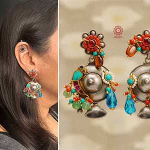 Noori two tone earrings in 92.5 sterling silver. Handcrafted earrings with  beautiful turquoise parrot motif and semi precious stones. Style these eclectic earrings with your favourite ethnic or fusion outfit. 