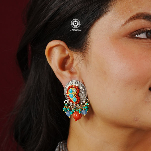 Noori two tone earrings in 92.5 sterling silver. Handcrafted earrings with beautiful semi precious stones. Style this up with your favourite ethnic or fusion outfit.