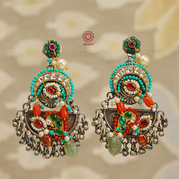 Noori two tone handcrafted earrings in 92.5 sterling silver with dual tones. Eclectic mix of elements with beautiful beads and semi precious stones. Style this up with your favourite ethnic or fusion outfit.