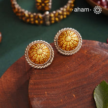 Enhance your style with the timeless elegance of the Dual Tone Silver Earrings. Handcrafted by skilled karigars in Barmer, Rajasthan, this earring features traditional Bandhel work, where a thin sheet of hand beaten 22 carat gold is set on 92.5 silver using a unique wax filling technique. A classic representation of Indian craftsmanship.