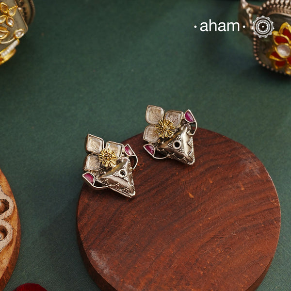 These Noori Two Tone Silver Earrings are both charming and elegant. The deep pink stones paired with a gold highlighted flower in the center add a touch of femininity to any outfit. Crafted in 92.5 silver, these earrings are also a high quality and durable option for everyday wear.