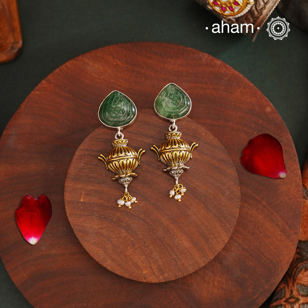 Noori two tone earrings. The earrings are handcrafted in 92.5 sterling silver with craved stone and gold highlights.& Style this up with your favourite ethnic or fusion outfits to complete the look.