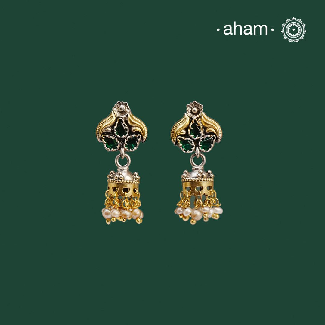 Noori two tone Jhumkie. The earrings are handcrafted in 92.5 sterling silver with gold highlights. Style this up with your favourite ethnic or fusion outfits to complete the look.